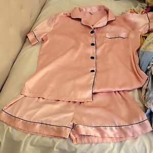 Very feminine pink with black trim silky pajama short set.  Size medium